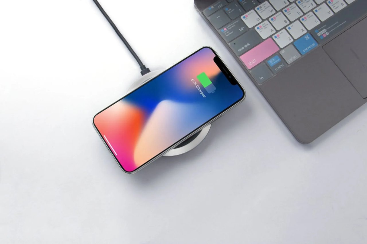 Smartphone charging on a white wireless pad