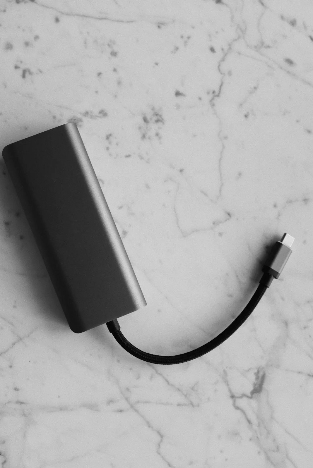 Power bank with USB-C cable on a marble desk